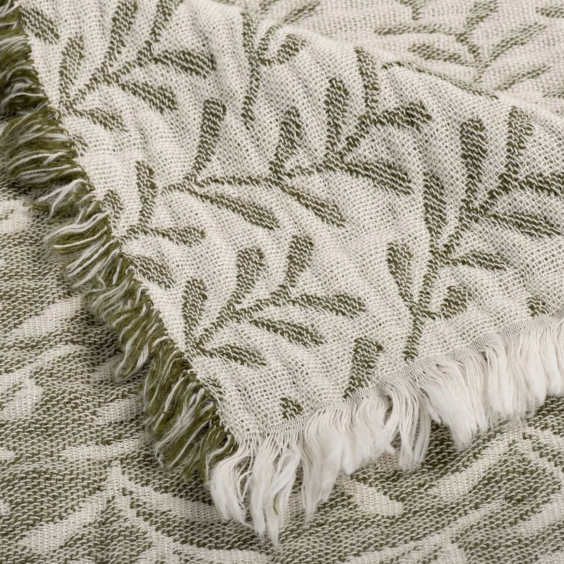 Plaid en coton motif feuilles finition franges 130x170cm - vert